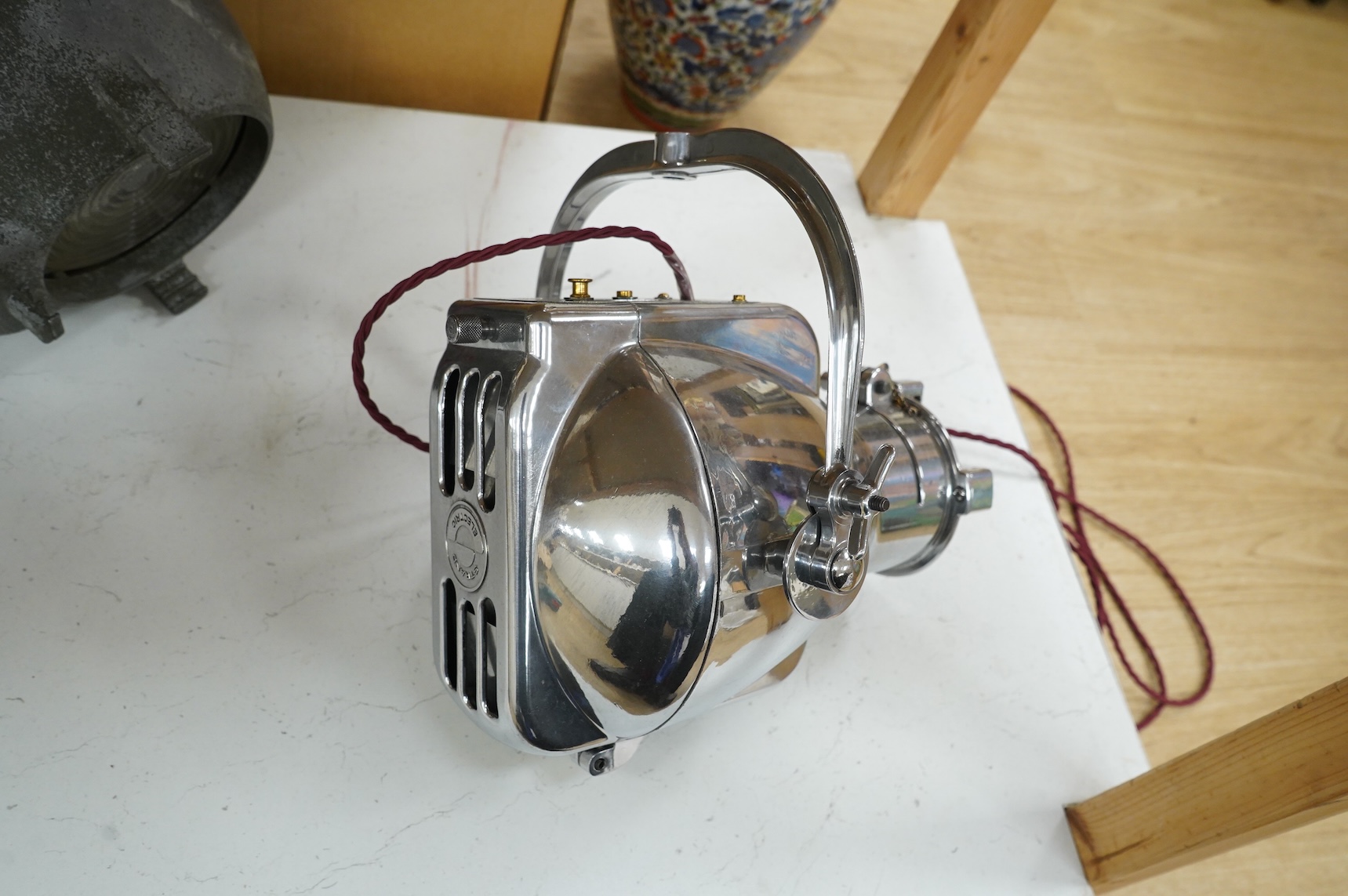 A vintage Strand electric chrome theatre lamp
